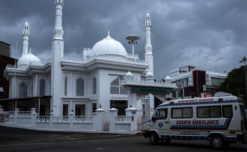 An ambulance drives past a mosque that remains closed as people offered prayers at their homes during a lockdown imposed to curb the spread of the coronavirus in Kochi, Kerala. (AP Photo) An ambulance drives past a mosque that remains closed as people offered prayers at their homes during a lockdown imposed to curb the spread of the coronavirus in Kochi, Kerala. (AP Photo)