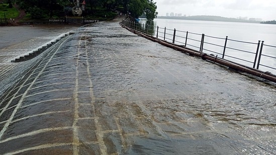 Vihar Lake seen overflowing following heavy rainfall, in Mumbai on July 18. A Brihanmumbai Municipal Corporation (BMC) statement said Vihar Lake, with a storage capacity of 27,698 million litres, is the smallest of the water bodies that are part of the supply mechanism to the metropolis.(ANI)