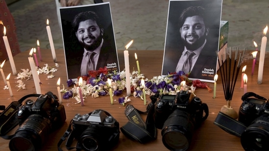 A candlelight tribute to Pulitzer prize winner photojournalist Danish Siddiqui, who was killed in clashes with Taliban in Afghanistan, at the press club in Guwahati, on Sunday.(PTI Photo) A candlelight tribute to Pulitzer prize winner photojournalist Danish Siddiqui, who was killed in clashes with Taliban in Afghanistan, at the press club in Guwahati, on Sunday.(PTI Photo)