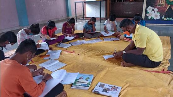Students of Tamini high school in Mulshi, study in a hall keeping Covid norms in place. Many parents are willing to send students to schools provided the virus prevention measures are in place. (HT PHOTO)