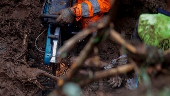 Rescuers perform search operations in the Mahul area of Mumbai on Sunday.(AP Photo/Rajanish Kakade)