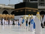 TOPSHOT - Pilgrims arrive at the Kaaba, Islam's holiest shrine, at the Grand mosque in the holy city of Meccca, at the start of the Hajj season, on July 17, 2021. - Saudi Arabia hosts another downsized hajj from July 17, with only residents fully vaccinated against the coronavirus permitted and overseas Muslim pilgrims barred for a second year. The annual ritual is a central pillar of Islam and a must for able-bodied Muslims at least once in their lifetime.(AFP) TOPSHOT - Pilgrims arrive at the Kaaba, Islam's holiest shrine, at the Grand mosque in the holy city of Meccca, at the start of the Hajj season, on July 17, 2021. - Saudi Arabia hosts another downsized hajj from July 17, with only residents fully vaccinated against the coronavirus permitted and overseas Muslim pilgrims barred for a second year. The annual ritual is a central pillar of Islam and a must for able-bodied Muslims at least once in their lifetime.(AFP)