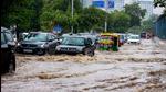 Vehicles wade through a waterlogged street after heavy rains near Medicity Hospital in Gurugram on Monday, July 19. (PTI) Vehicles wade through a waterlogged street after heavy rains near Medicity Hospital in Gurugram on Monday, July 19. (PTI)