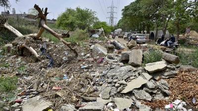 Construction and demolition waste in green belts of Model Town in Ludhiana on Monday. (Gurpreet Singh/HT) Construction and demolition waste in green belts of Model Town in Ludhiana on Monday. (Gurpreet Singh/HT)