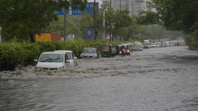 Vehicles wade through a waterlogged road near ITO in New Delhi in Monday, July 19. (PTI) Vehicles wade through a waterlogged road near ITO in New Delhi in Monday, July 19. (PTI)