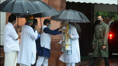 Prime Minister Narendra Modi being greeted by BJP leader Pralhad Joshi as he arrives to address the media on the first day of the monsoon session of Parliament, in New Delhi on Monday, July 19. (PTI) Prime Minister Narendra Modi being greeted by BJP leader Pralhad Joshi as he arrives to address the media on the first day of the monsoon session of Parliament, in New Delhi on Monday, July 19. (PTI)