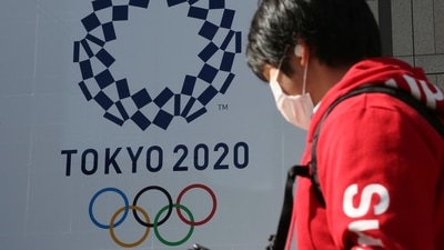 A man walks past the Tokyo 2020 symbol. (AP)