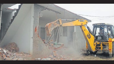 An illegal construction being razed in Giaspura area of Ludhiana on Monday. (ht photo) An illegal construction being razed in Giaspura area of Ludhiana on Monday. (ht photo)