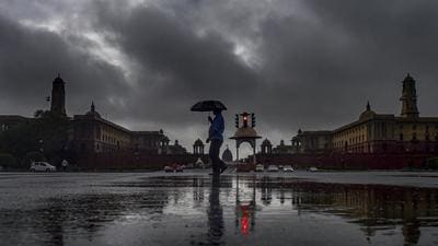A man walks past Vijay Chowk during rains in New Delhi. (File photo)