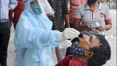 A health worker collects swab samples for Covid-19 tests in Nagpur, Maharashtra. (PTI)