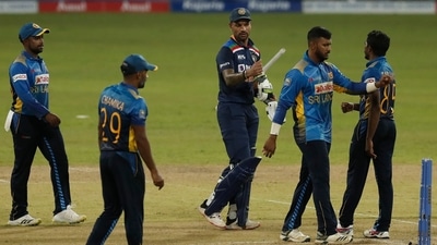 India's captain Shikhar Dhawan walks off the pitch after defeating Sri Lanka by seven wickets in their first one day international cricket match in Colombo. (AP)