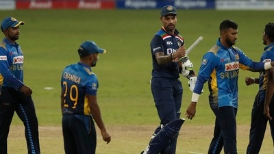 India's captain Shikhar Dhawan walks off the pitch after defeating Sri Lanka by seven wickets in their first one day international cricket match in Colombo. (AP)