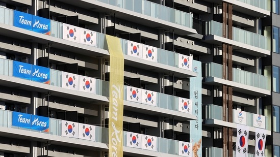 South Korean flags and signs hang on the building housing Olympics participants, Athletes' Village, where one person tested positive for Covid-19, in Tokyo on July 17. The Olympic Village, an apartment and dining complex in Tokyo, will host 6,700 athletes and officials at its peak when the delayed 2020 Games finally begin, AFP reported. (Kim Kyung-Hoon / REUTERS)
