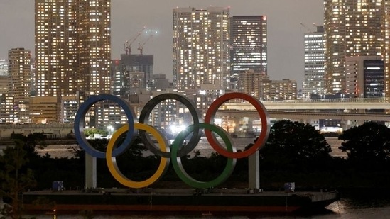 The Olympic rings installed on a floating platform can be seen in front of the city skyline ahead of the Tokyo 2020 Olympics on July 14. Tokyo reported 1,008 new cases of COVID-19 on July 18, the fifth day in a row with more than 1,000 cases. The Olympics will open on July 23 under a state of emergency in Tokyo and three neighboring prefectures, AP reported. (Fabrizio Bensch / REUTERS)