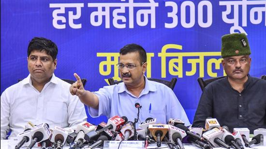 Delhi chief minister Arvind Kejriwal along with Uttarakhand AAP in-charge Dinesh Mohaniya (left) and Colonel Ajay Kothiyal (right) during a press conference in Dehradun on July 11. (PTI)