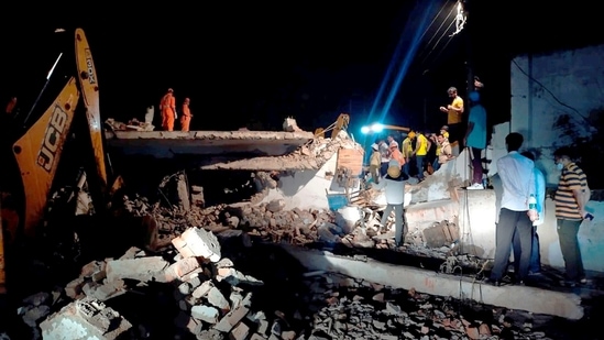  NDRF team during a rescue operation after a three-storey building collapsed at Khawaspur in Gurugram, Sunday, July 18, 2021.(PTI)