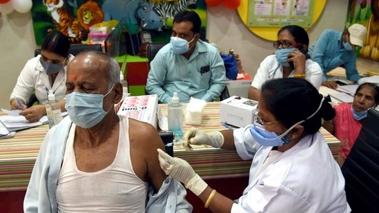 An eligible beneficiary receives a shot of Covid-19 vaccine in Patna.(ANI Photo)