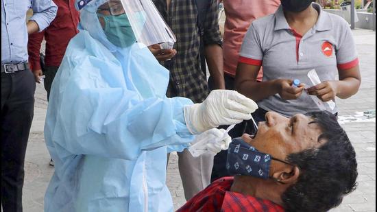 A health worker collects swab samples for Covid-19 tests in Nagpur, Maharashtra. (PTI)