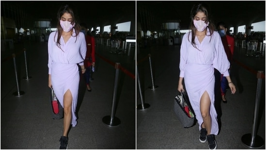 Janhvi wore the dress with a matching lilac face mask with pink details. Keeping comfort in mind, the actor teamed her dress with black lace-up chunky sneakers and ditched accessories.(Varinder Chawla)