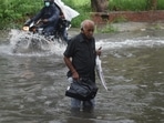An elderly commuter attempts to cross a waterlogged stretch near ITO in New Delhi, on July 19. After a weeks-long wait, the hot, humid days in Delhi on July 19 gave way to the season’s first spell of heavy rain, which proved to be a nightmare for motorists and commuters across the city.(Raj K Raj / HT Photo) An elderly commuter attempts to cross a waterlogged stretch near ITO in New Delhi, on July 19. After a weeks-long wait, the hot, humid days in Delhi on July 19 gave way to the season’s first spell of heavy rain, which proved to be a nightmare for motorists and commuters across the city.(Raj K Raj / HT Photo)