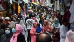 People shop ahead of the Eid al-Adha festival, in Srinagar. People shop ahead of the Eid al-Adha festival, in Srinagar.