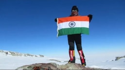 Arunima Sinha standing on top of Mt. Everest.