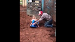 The image shows the toddler in his first rodeo.