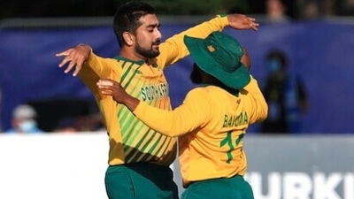 South Africa's Tabraiz Shamsi, left, celebrates with Temba Bavuma. (AP)