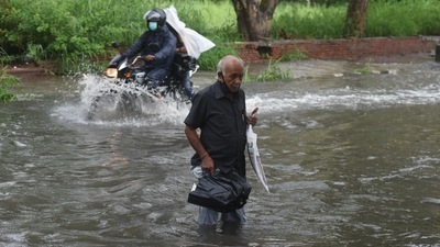 An elderly commuter attempts to cross a waterlogged stretch near ITO in New Delhi, on July 19. After a weeks-long wait, the hot, humid days in Delhi on July 19 gave way to the season’s first spell of heavy rain, which proved to be a nightmare for motorists and commuters across the city. (Raj K Raj / HT Photo) An elderly commuter attempts to cross a waterlogged stretch near ITO in New Delhi, on July 19. After a weeks-long wait, the hot, humid days in Delhi on July 19 gave way to the season’s first spell of heavy rain, which proved to be a nightmare for motorists and commuters across the city. (Raj K Raj / HT Photo)