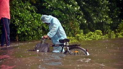 A man wades through a waterlogged stretch along Ring Road near ITO during heavy rain in New Delhi. (Raj K Raj/HT Photo) A man wades through a waterlogged stretch along Ring Road near ITO during heavy rain in New Delhi. (Raj K Raj/HT Photo)