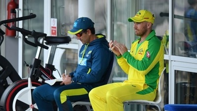 Australia's head coach Justin Langer with Aaron Finch Pool via REUTERS/Dan Mullan (Pool via REUTERS)