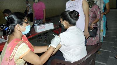 A health worker administers a Covid-19 vaccine dose to a woman at the Government vaccination centre at Ghanta Ghar, Ramleela Ground, in Ghaziabad on Monday, July 19. (Sakib Ali/HT photo) A health worker administers a Covid-19 vaccine dose to a woman at the Government vaccination centre at Ghanta Ghar, Ramleela Ground, in Ghaziabad on Monday, July 19. (Sakib Ali/HT photo)