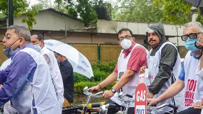 TMC MPs cycle to Parliament to protest against hike in fuel prices, in New Delhi on Monday, July 19. (File photo)