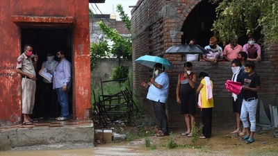 People, some carrying umbrellas wait outside a Covid-19 vaccination centre at Shivaji Nagar, in Gurugram, on July 19. Gurugram received 185mm of rainfall over the past two days, which is almost 39% of the total rainfall it receives in the monsoon, officials of the India Meteorological Department (IMD) told HT. (Vipin Kumar / HT Photo) People, some carrying umbrellas wait outside a Covid-19 vaccination centre at Shivaji Nagar, in Gurugram, on July 19. Gurugram received 185mm of rainfall over the past two days, which is almost 39% of the total rainfall it receives in the monsoon, officials of the India Meteorological Department (IMD) told HT. (Vipin Kumar / HT Photo)