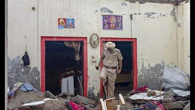 A policeman inspects the spot where the roof of a house collapsed after heavy rain at Matauli village in Patiala. (PTI) A policeman inspects the spot where the roof of a house collapsed after heavy rain at Matauli village in Patiala. (PTI)