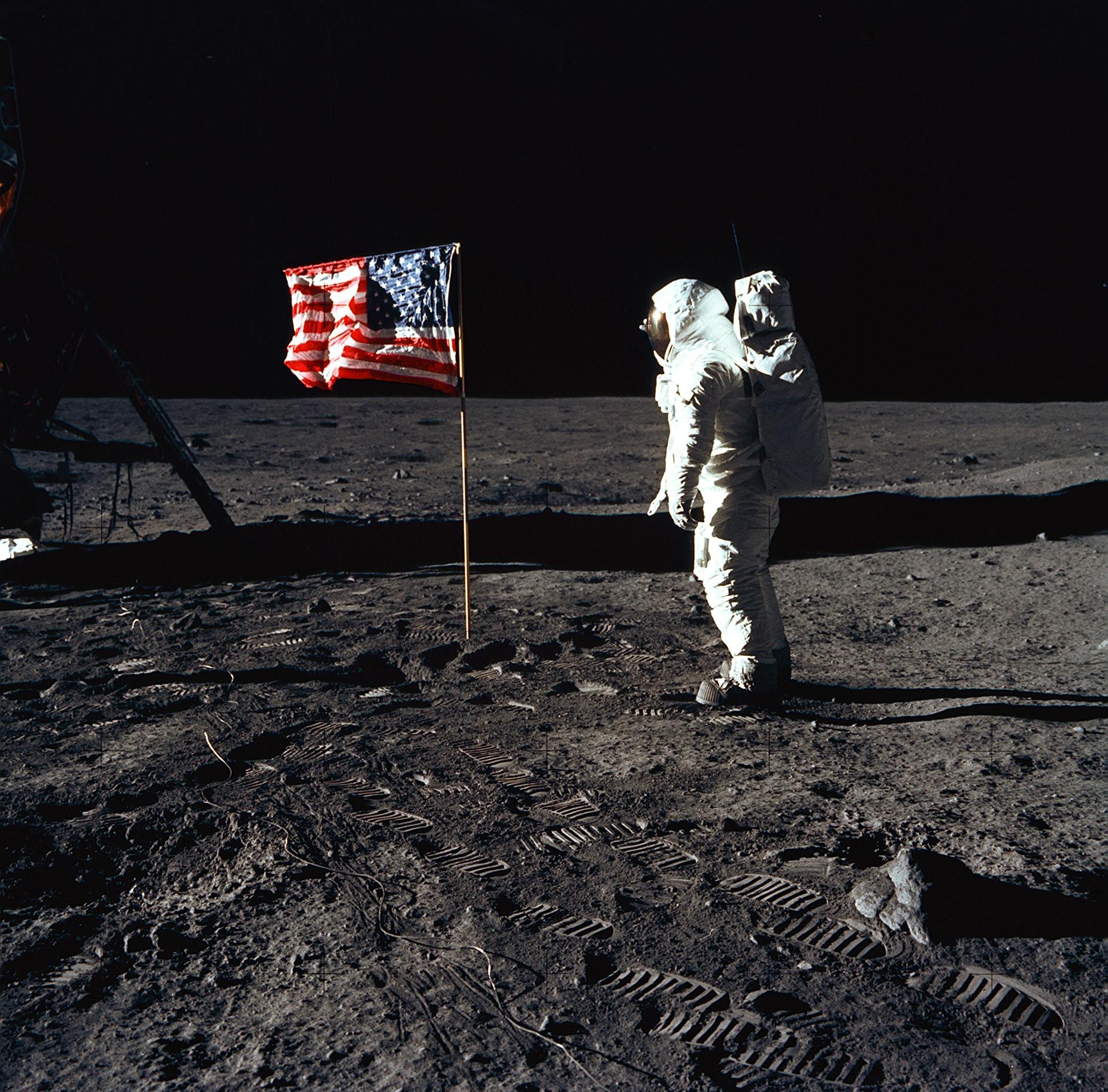 Astronaut poses for a photograph beside the deployed United States flag during an Apollo 11 extravehicular activity (EVA) on the lunar surface.(NASA) Astronaut poses for a photograph beside the deployed United States flag during an Apollo 11 extravehicular activity (EVA) on the lunar surface.(NASA)
