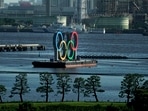 A barge with the Olympic rings mounted on it floats in the water ahead of the 2020 Summer Olympics(AP) A barge with the Olympic rings mounted on it floats in the water ahead of the 2020 Summer Olympics(AP)