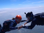 The image shows the skydivers in action.
