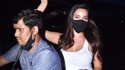 Nora Fatehi hitches a ride on a scooter. Nora Fatehi hitches a ride on a scooter.