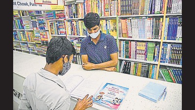 A student, who is preparing for the CET exam, at a bookstall at Appa Balwant chowk, on Tuesday. (HT PHOTO) A student, who is preparing for the CET exam, at a bookstall at Appa Balwant chowk, on Tuesday. (HT PHOTO)