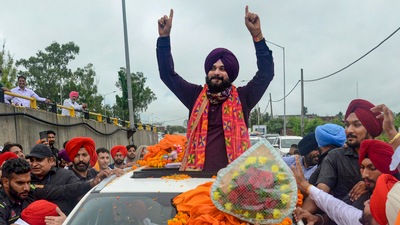 Newly appointed Punjab Pradesh Congress Committee president Navjot Singh Sidhu being welcomed by his supporters during his visit to Amritsar. (PTI)