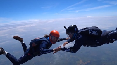 The image shows the skydivers in action. (Facebook/@carexuk)