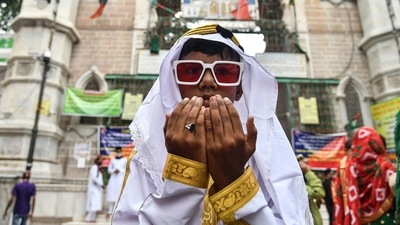 A young devotee offers prayers during the 'Festival of Sacrifice, in Ajmer. (Shaukat Ahmed/AFP) A young devotee offers prayers during the 'Festival of Sacrifice, in Ajmer. (Shaukat Ahmed/AFP)