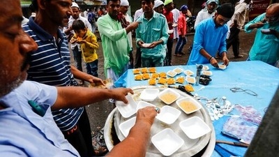 A man serves vermicelli at a roadside stall on Eid al-Adha festival in Kolkata. (AP Photo/Bikas Das) A man serves vermicelli at a roadside stall on Eid al-Adha festival in Kolkata. (AP Photo/Bikas Das)