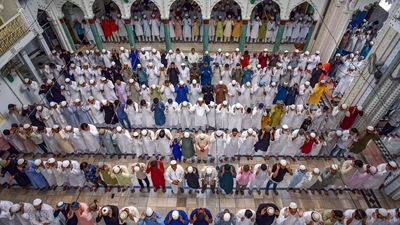 Devotees offer prayers on the occasion of Eid al-Adha at Vashi Ullah mosque in Prayagraj in the wee hours of Wednesday. (PTI) Devotees offer prayers on the occasion of Eid al-Adha at Vashi Ullah mosque in Prayagraj in the wee hours of Wednesday. (PTI)