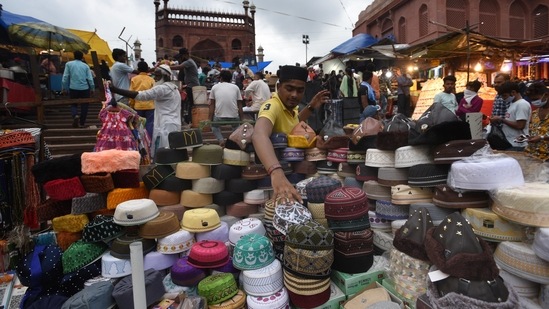 A shopkeeper arrangers his goods at the market area near Jama Masjid on the eve of Eid ul-Adha in Delhi on Tuesday.(Arvind Yadav/HT PHOTO)
