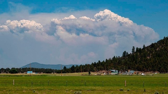 Smoke rises from the Bootleg Fire in southern Oregon on July 18. Monstrous clouds of smoke and ash have risen up to 6 miles into the sky and are visible for more than 100 air miles.(Bootleg Fire Incident Command via AP)