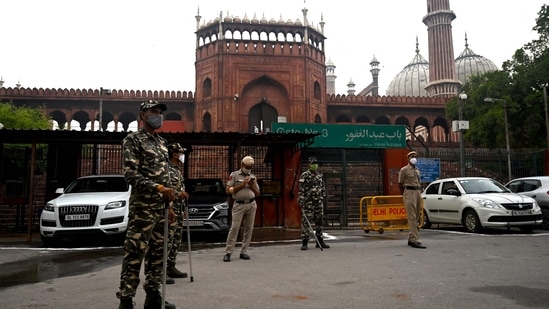 Security forces stand guard outside the Jama Masjid on the early hours of Wednesday. (Money SHARMA/AFP)