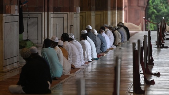 Early morning visuals of Jama Masjid showed a handful of people in the Jama Masjid mosque in the shadow of a heavy police security blanket prohibiting crowding.(Money Sharma/AFP)