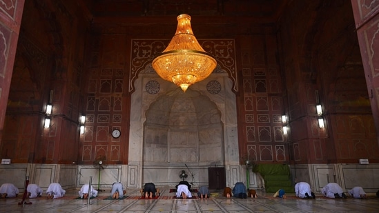 Muslim devotees offer special morning prayers during the Eid al-Adha festival, the feast of sacrifice at the Jama Masjid on Wednesday.(Money Sharma/AFP)